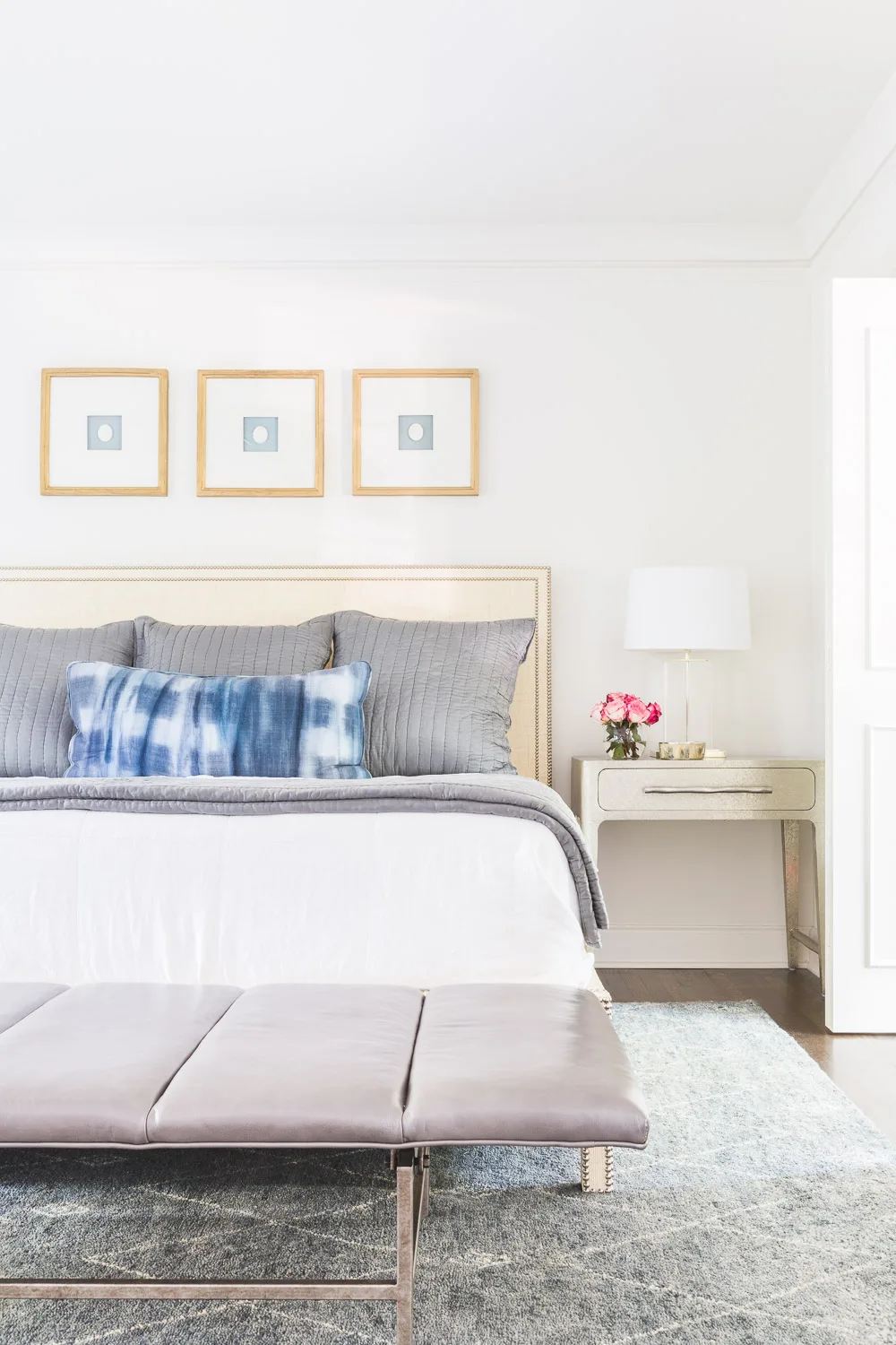 How to Decorate Above A Bed - Row of Frames