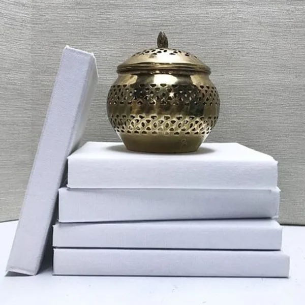Books Covered in White Fabric